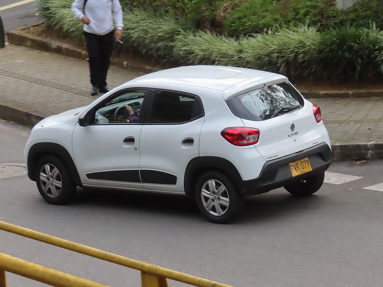 An older white Renault Kwid photographed on a street in Medellín in September 2022; not the announced 2027 Mexican model