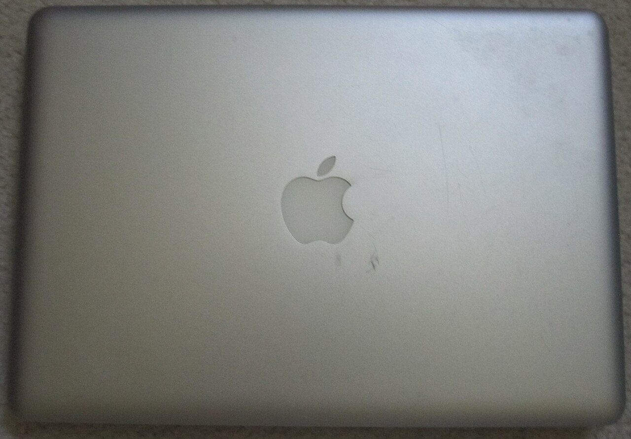 Closed lid of an older MacBook Pro identified by its photographer as a 2012 model, not the new M6 laptop