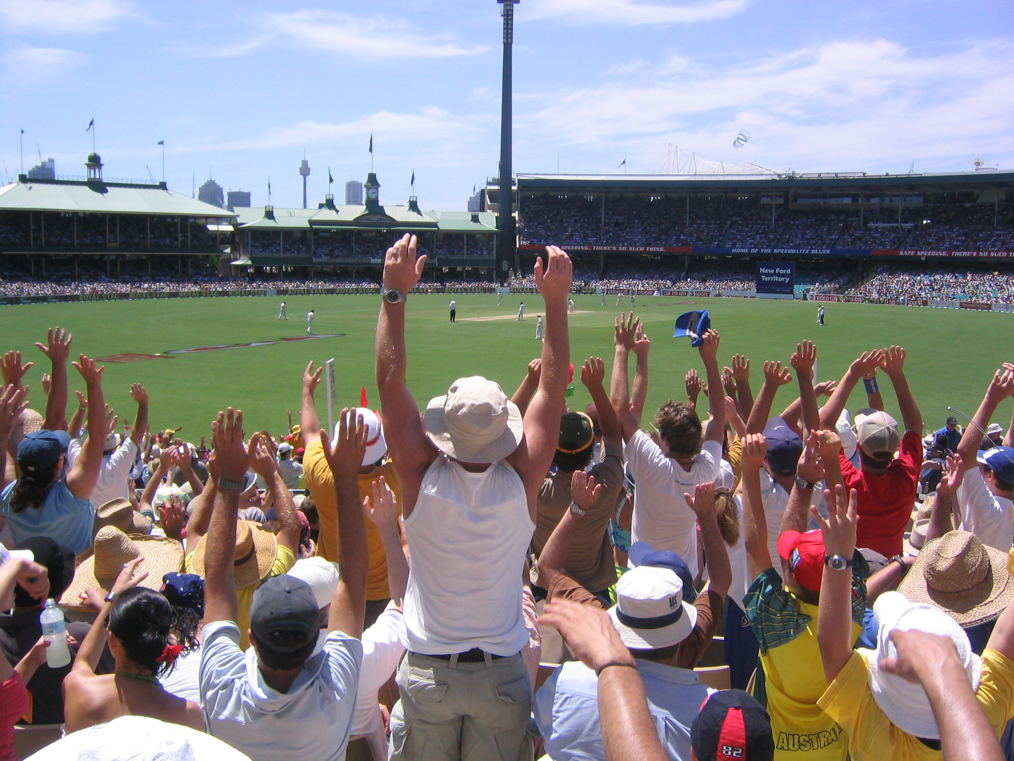 Spectators raising their arms during cricket at the Sydney Cricket Ground in January 2004; archive venue context, not Dane Rampe's retirement